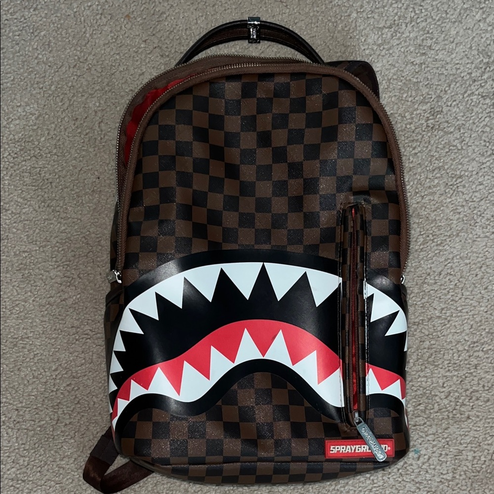 Sprayground Brown & Black Checkerboard Shark Bite Backpack with Red Accent